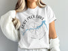 White t-shirt with "Fort Peck Lake Montana" and lake outline graphic.