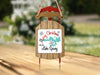 Sled ornament with "Merry Christmas from Lake Spivey" text and snowflake designs.