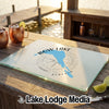 A glass cutting board featuring a blue map of Bow Lake, Alberta, with a compass design.