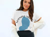 White t-shirt with Newnans Lake Florida text and blue lake design.