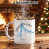 White mug with Stockton Lake, Missouri map and compass design, steaming coffee.