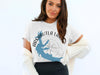 White t-shirt with Arkabutla Lake Mississippi contour map and compass graphic.
