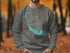 Gray sweatshirt with "Beautiful Sanibel Island Florida" and compass rose map.