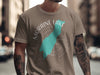 Moraine Lake Alberta graphic on a tan t-shirt with compass and lake shape.