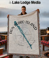 Woven throw with compass and "Don Pedro Island Florida" text.