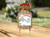 Sled ornament with "Merry Christmas" and "From Lake Minnewaukan" text.