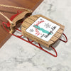Wooden sleigh ornament with "Merry Christmas From Honovee Lake" text.