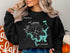 Black sweatshirt with a compass and map of Lake Texoma, Oklahoma.