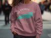 Dusty rose sweatshirt with white Lake Ontario map and compass graphic.