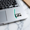 Conesus Life sticker on a laptop keyboard.