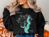 Black sweatshirt with "Lake Ray Hubbard Texas" and compass design.