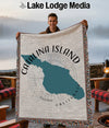 Woven throw featuring a teal silhouette of Catalina Island, California.