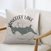 Decorative throw pillow featuring a map and compass rose of Rangeley Lake, Maine, resting on a white armchair.