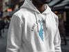 White hoodie with blue Lake Cascade, Idaho map graphic and compass rose.