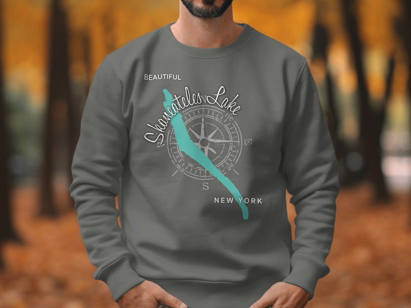 Grey sweatshirt with "Beautiful Skaneateles Lake" and compass graphic.
