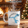 White mug with Nantahala Lake map and compass on a rustic table.