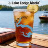 Glass with iced tea and lemon, featuring a compass and lake graphic.