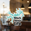 Turquoise lake outline sticker with text "Mark Twain Life" on glass.