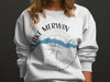 White sweatshirt with "Lake Merwin Washington" and a compass rose design.