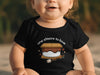 Black baby onesie with "one s'more to love" text and s'more graphic.