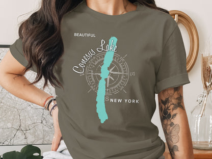 T-shirt with "Conesus Lake, New York" and compass rose graphic.