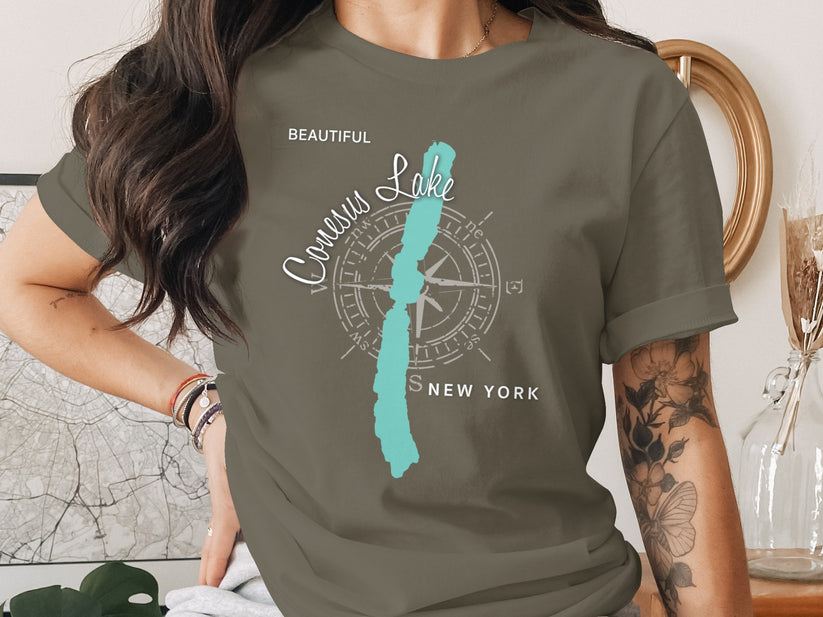T-shirt with "Conesus Lake, New York" and compass rose graphic.