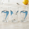Three clear glasses each feature a blue map of Rushford Lake and a compass rose design.