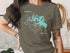Olive t-shirt with a compass and map of Canyon Lake, Texas.