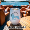 A white travel tumbler with a blue Marco Island, Florida map graphic sitting on a wooden boat table.