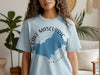 Light blue t-shirt with "Lake Mascuppic New Hampshire" graphic.