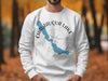 White sweatshirt with Chautauqua Lake New York graphic and compass rose.