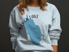Light blue sweatshirt with Black Lake New York map and compass graphic.