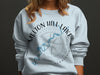 Light blue sweatshirt with Melton Hill Lake Tennessee map and compass graphic.