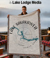 Throw blanket with Lake Sakakawea map design and Lake Lodge Media logo.