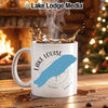 White mug with "Lake Louise" and blue lake shape on compass design.