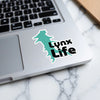 Turquoise lynx silhouette sticker with bold text "Lynx Life" on a laptop.