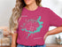 Pink t-shirt with teal Lake Springfield map and compass rose design.
