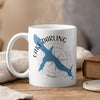 White mug with blue Lake Darling Iowa outline and compass design.