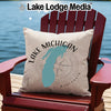 Pillow with Lake Michigan map and compass on red Adirondack chair.