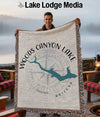 Woven blanket with "Woods Canyon Lake Arizona" text, compass, and shark graphic.