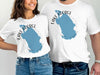White t-shirts featuring a blue map of Lake George, Florida, with compass rose.