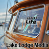"George Life" sticker on boat window with "Lake Lodge Media" text below.