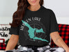 Black t-shirt with turquoise Hebgen Lake, Montana map design and compass.