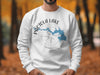 White sweatshirt with Pactola Lake map design and compass on a man.