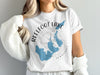 White t-shirt with "Reelfoot Lake Tennessee" and map graphic.