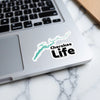 Cherokee Life sticker with teal lake outline and black text on laptop.