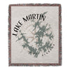 Woven blanket with "Lake Martin Alabama" text, compass, and lake outline design.