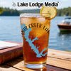 Glass with iced tea, lemon slice, and a blue Cedar Creek Lake map design.