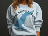 Light blue sweatshirt with a blue map of Ross Barnett Lake, Mississippi, and compass design.