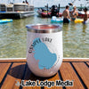 White stainless steel travel tumbler with an Ossipee Lake New Hampshire map graphic rests on a wooden boat deck with swimmers and boats in the background.